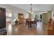 Dining room with wooden table and chairs, hardwood floors at 16967 Se 93Rd Cuthbert Cir, The Villages, FL 32162