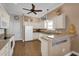 White kitchen with ample counter space and stainless steel appliances at 16967 Se 93Rd Cuthbert Cir, The Villages, FL 32162