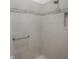 Clean shower with light gray tile and a grab bar at 5911 Delphina Loop, The Villages, FL 32163