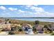 Aerial view of a house and lakefront community at 10173 Lake Miona Way, Oxford, FL 34484