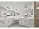 Bathroom with double vanity, soaking tub and shower at 10173 Lake Miona Way, Oxford, FL 34484