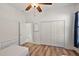 Bedroom with twin bed and double closet at 10173 Lake Miona Way, Oxford, FL 34484