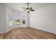 Bright bedroom with hardwood floors and bay window at 10173 Lake Miona Way, Oxford, FL 34484