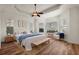 Bright bedroom with hardwood floors and ceiling fan at 10173 Lake Miona Way, Oxford, FL 34484