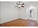 Bright bedroom with hardwood floors and a ceiling fan at 10173 Lake Miona Way, Oxford, FL 34484