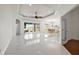 Bright and airy living room with white tile floors and access to the backyard at 10173 Lake Miona Way, Oxford, FL 34484