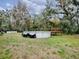 Large backyard with above ground pool and wooden deck at 1029 Cr 452A, Lake Panasoffkee, FL 33538