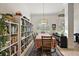 Spacious dining room with built-in shelving and a large table at 10377 Silver Maple Ave, Oxford, FL 34484