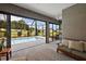 Interior view of pool area with comfortable seating and large windows at 10377 Silver Maple Ave, Oxford, FL 34484