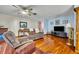 Living room featuring hardwood floors, and comfortable furniture at 1101 Lantana Dr, Eustis, FL 32726