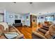 Hardwood floor living room with light blue walls and comfy seating at 1101 Lantana Dr, Eustis, FL 32726