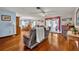 Living room with hardwood floors, fireplace, and comfy seating at 1101 Lantana Dr, Eustis, FL 32726