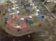 Large lot size and neighborhood context showcased in this aerial view at 11189 Roz Way, Oxford, FL 34484