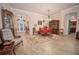 Elegant dining room with tiled floors and antique furniture at 11189 Roz Way, Oxford, FL 34484