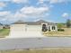 Beautiful 3-car garage home with landscaped yard at 11189 Roz Way, Oxford, FL 34484