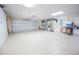 Organized garage with epoxy flooring and ample storage at 11189 Roz Way, Oxford, FL 34484