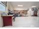 Well-equipped garage workshop with various tools and storage at 11189 Roz Way, Oxford, FL 34484