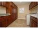 Bright laundry room with washer, dryer, and ample cabinetry at 11189 Roz Way, Oxford, FL 34484