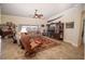 Relaxing living room with large windows and a fireplace at 11189 Roz Way, Oxford, FL 34484