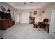 Relaxing sitting area with a comfortable chair and plenty of natural light at 11189 Roz Way, Oxford, FL 34484