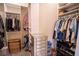 Spacious walk-in closet with built-in shelving and drawers at 11189 Roz Way, Oxford, FL 34484