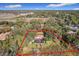 Aerial view of home with large lot and water view at 1130 Elysium Blvd, Mount Dora, FL 32757