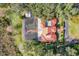 Aerial view of a house with a pool and a large yard at 1130 Elysium Blvd, Mount Dora, FL 32757