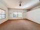 Bonus room with carpet, window, and door to garage at 1130 Elysium Blvd, Mount Dora, FL 32757