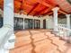 Elegant stairway leading to covered patio with terracotta tile flooring at 1130 Elysium Blvd, Mount Dora, FL 32757