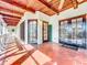 Outdoor patio with terracotta tile flooring and French doors leading inside at 1130 Elysium Blvd, Mount Dora, FL 32757