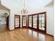 Bright dining room with hardwood floors and access to a patio at 1130 Elysium Blvd, Mount Dora, FL 32757