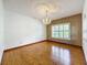 Bright dining room with hardwood floors and a large window with shutters at 1130 Elysium Blvd, Mount Dora, FL 32757