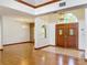 Bright and airy entryway with hardwood floors and elegant double doors at 1130 Elysium Blvd, Mount Dora, FL 32757