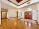 Bright and airy entryway with hardwood floors and elegant double doors at 1130 Elysium Blvd, Mount Dora, FL 32757