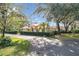 Landscaped home exterior with red tile roof and driveway at 1130 Elysium Blvd, Mount Dora, FL 32757