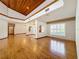 Open living room featuring hardwood floors and high ceilings at 1130 Elysium Blvd, Mount Dora, FL 32757