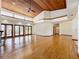 Spacious living room featuring hardwood floors, high ceilings, and a fireplace at 1130 Elysium Blvd, Mount Dora, FL 32757