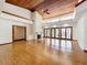 Bright living area with hardwood floors, fireplace and French doors at 1130 Elysium Blvd, Mount Dora, FL 32757