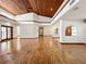 Large living room with hardwood floors, high ceilings and wood beams at 1130 Elysium Blvd, Mount Dora, FL 32757