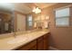 Elegant bathroom with dual sinks, large mirror, and ample counter space at 1189 Homeland Park St, The Villages, FL 32162