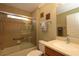 Bathroom with tub shower combo, vanity, and linen closet at 1189 Homeland Park St, The Villages, FL 32162