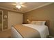 Guest bedroom with a queen-size bed and built-in closet at 1189 Homeland Park St, The Villages, FL 32162