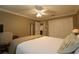 Guest bedroom with a queen-size bed and built-in closet at 1189 Homeland Park St, The Villages, FL 32162