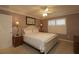 Spacious bedroom with a queen-size bed and wood nightstands at 1189 Homeland Park St, The Villages, FL 32162