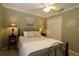 Guest bedroom with a double bed, nightstands, and double door closet at 1189 Homeland Park St, The Villages, FL 32162