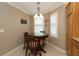 Breakfast nook features a round table and window seating at 1189 Homeland Park St, The Villages, FL 32162