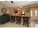 Kitchen with granite countertops and light wood cabinets at 1189 Homeland Park St, The Villages, FL 32162