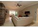 Spacious living room featuring a large sectional sofa and built-in shelving at 1189 Homeland Park St, The Villages, FL 32162