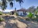 Ranch-style home with a brown roof and white exterior at 1199 Cr 542G, Bushnell, FL 33513