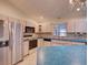 Kitchen with stainless steel appliances and teal countertops at 1199 Cr 542G, Bushnell, FL 33513